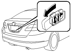 4. Slide the inside trunk release lever in the direction of the arrow.