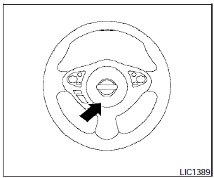 To sound the horn, push the center pad area of the steering wheel.