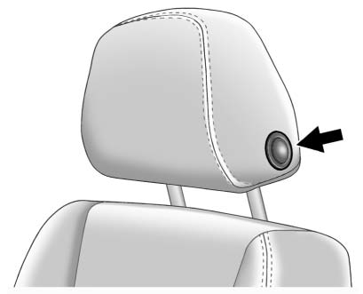 To raise or lower the head restraint, press the release button located on the side of the head restraint and pull up or push the head restraint down and release the button.