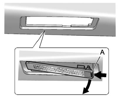1. Push the release tab (A) toward the lamp assembly.