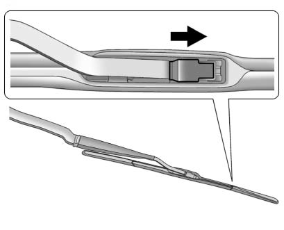 2. Lift up on the latch in the middle of the wiper blade where the wiper arm attaches.