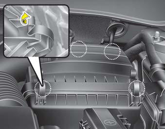 1. Loosen the air cleaner cover attaching clips and open the cover.