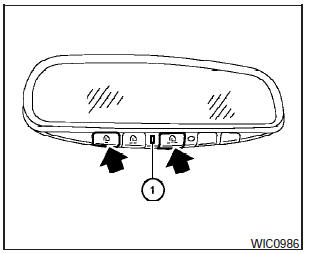 1. To begin, press and hold the two outer HomeLink buttons (to clear the memory)