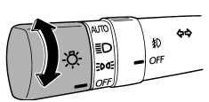 To turn on the headlights, turn the knob on the end of the turn signal lever.