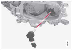 1. Remove the headlight housing from the vehicle (see page 306).